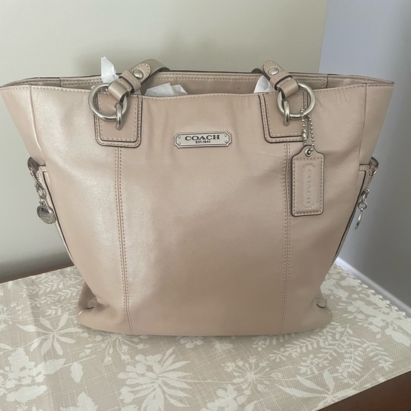 Beautiful coach purse, gently used. Champagne color with pink lining - Picture 1 of 2